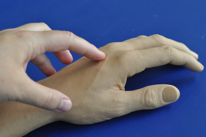 Out of control: the rubber hand illusion